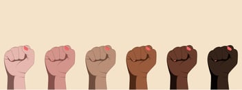 Women with painted nails raised their fists